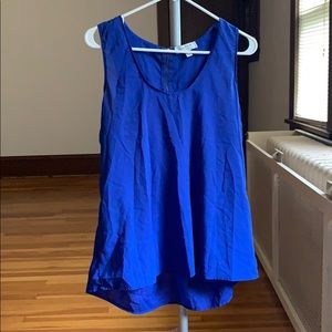 Bright blue sleeveless work blouse with zipper